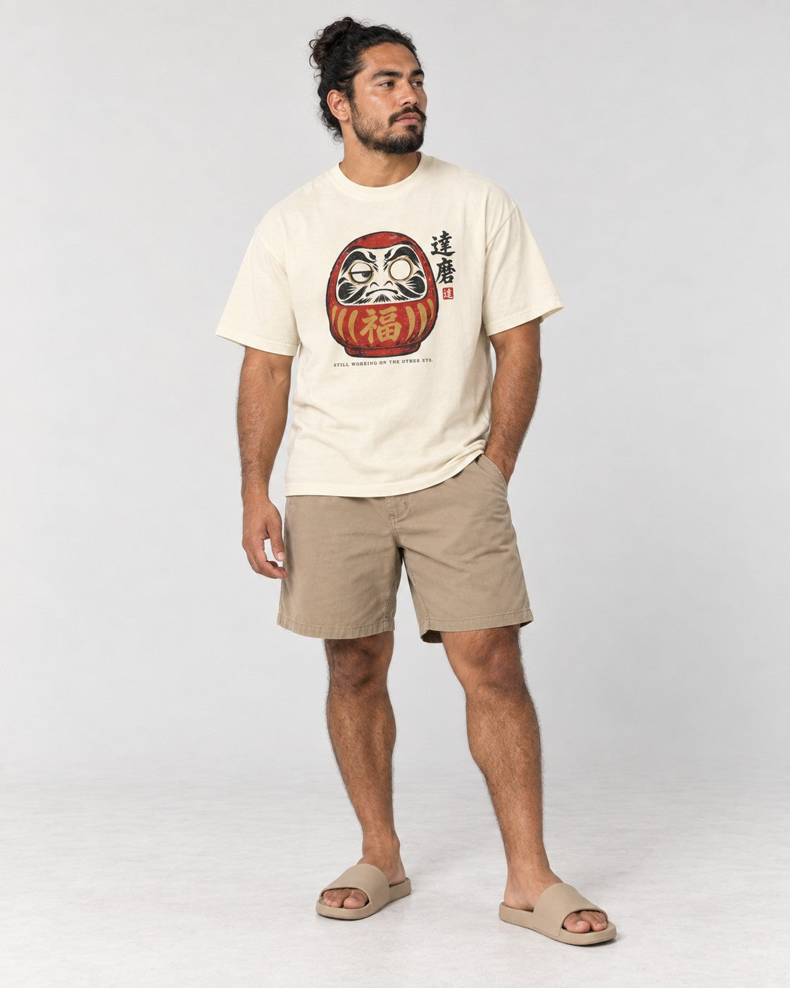 Still Working on the Other Eye Daruma T-Shirt in Ivory, full body